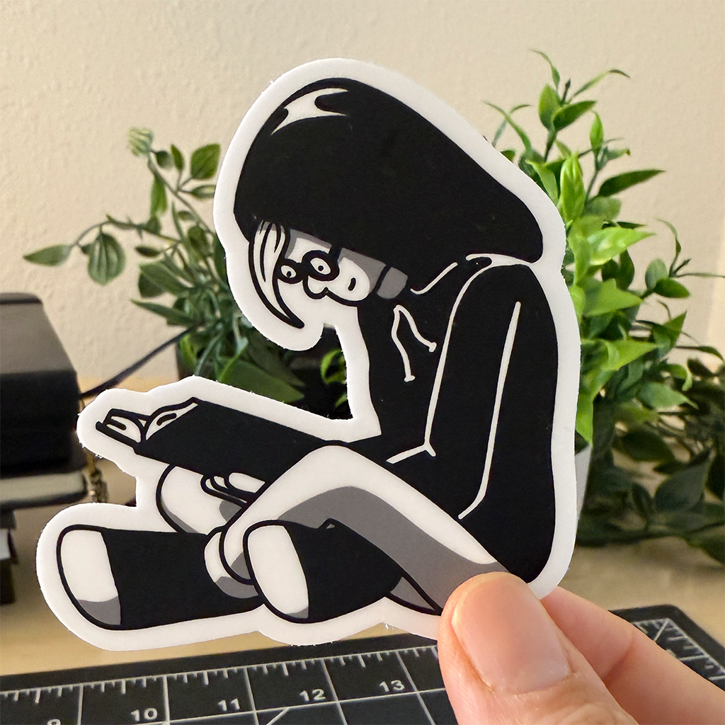Girl Reading in Hoodie Vinyl Sticker Waterproof 2.9" X 3"