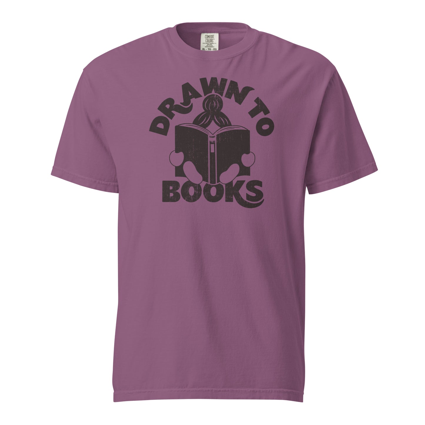 Berry Purple Pink Red t-shirt with Drawn to Books logo, text says "Drawn to Books" which is framed around a girl reading a book, and you can see only the top of her ponytail, hands and feet, and the big book she's reading.
