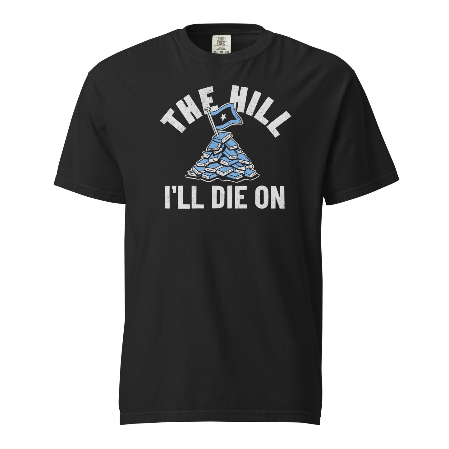Black Comfort Colors T-shirt with a hand-drawn illustration of a light blue stack of books with the phrase "The Hill I'll Die On."