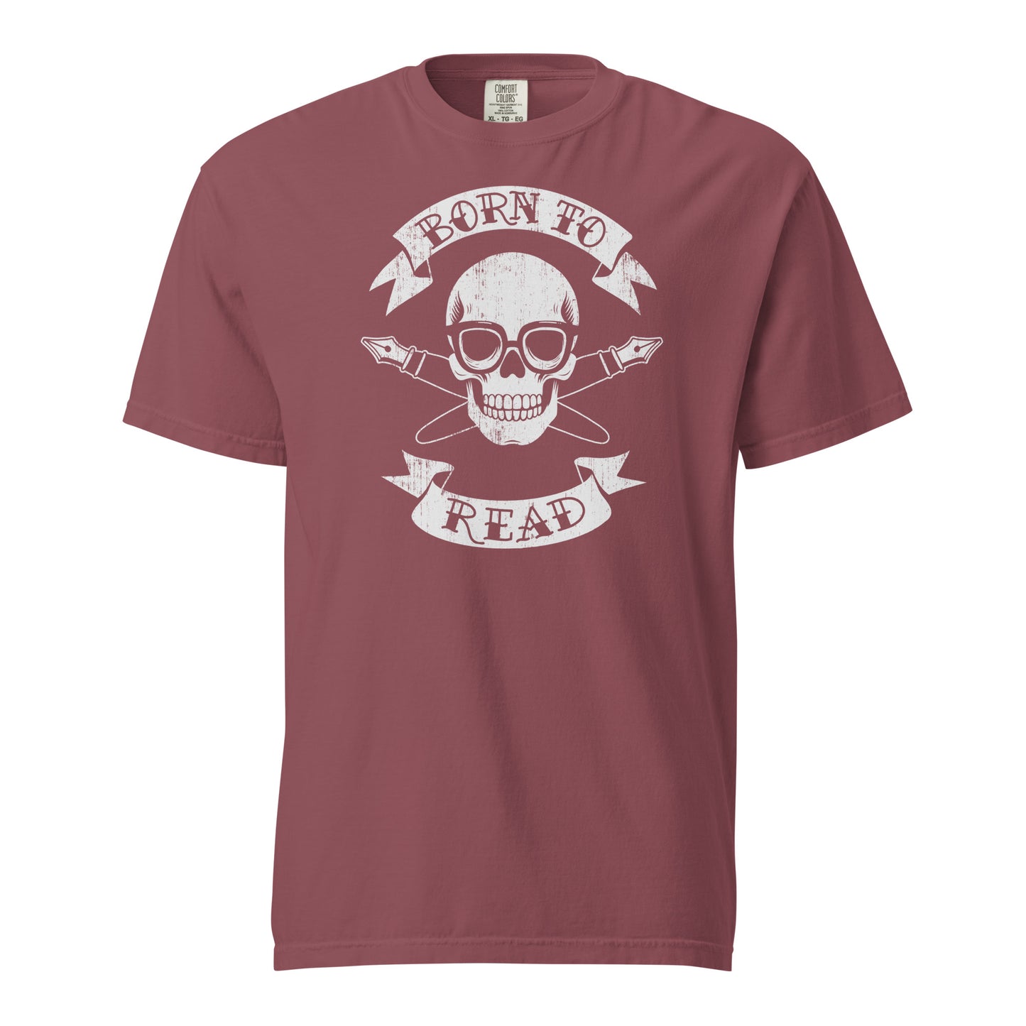 Brick Red Comfort Colors T-shirt with a hand-drawn illustration of a skull and crossbones, except instead of crossbones, it has crossed pens and he's wearing nerdy glasses. The text is in a banner on top and bottom that reads "Born to Read"