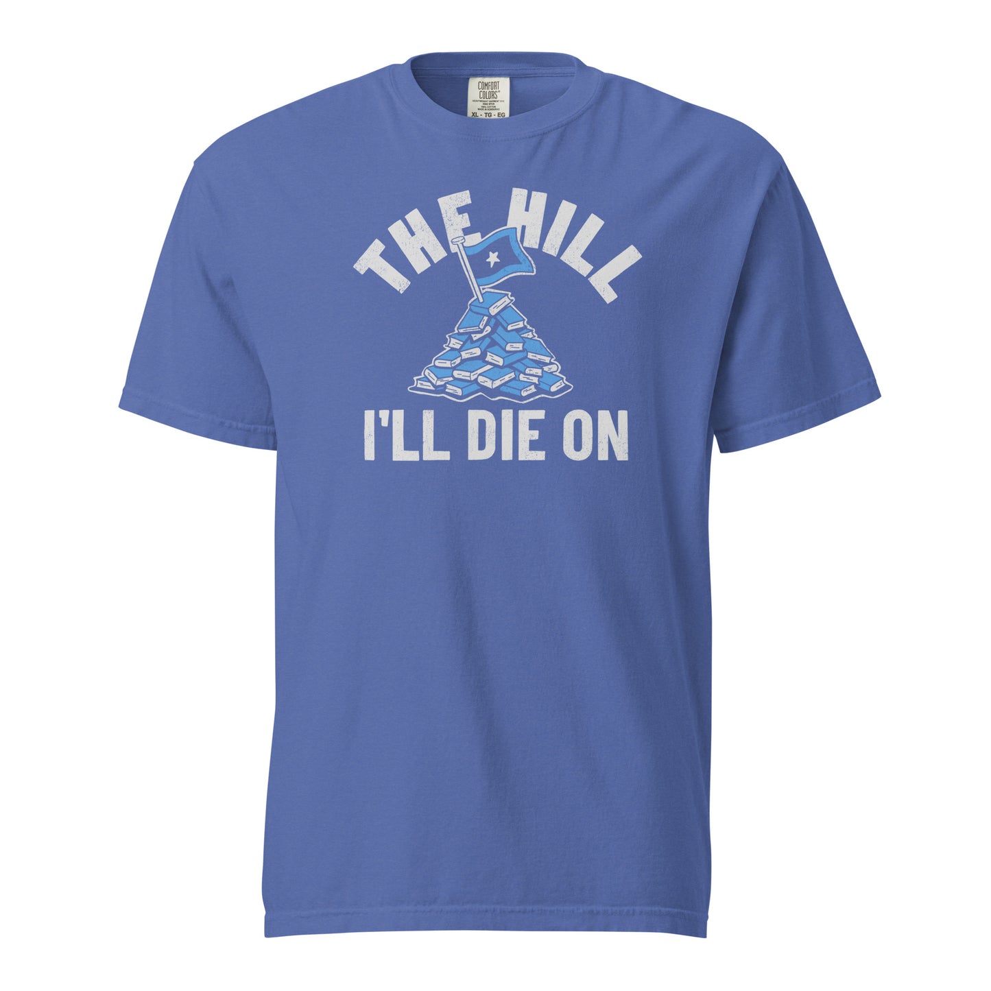 Mystic Blue Comfort Colors T-shirt with a hand-drawn illustration of a light blue stack of books with the phrase "The Hill I'll Die On."