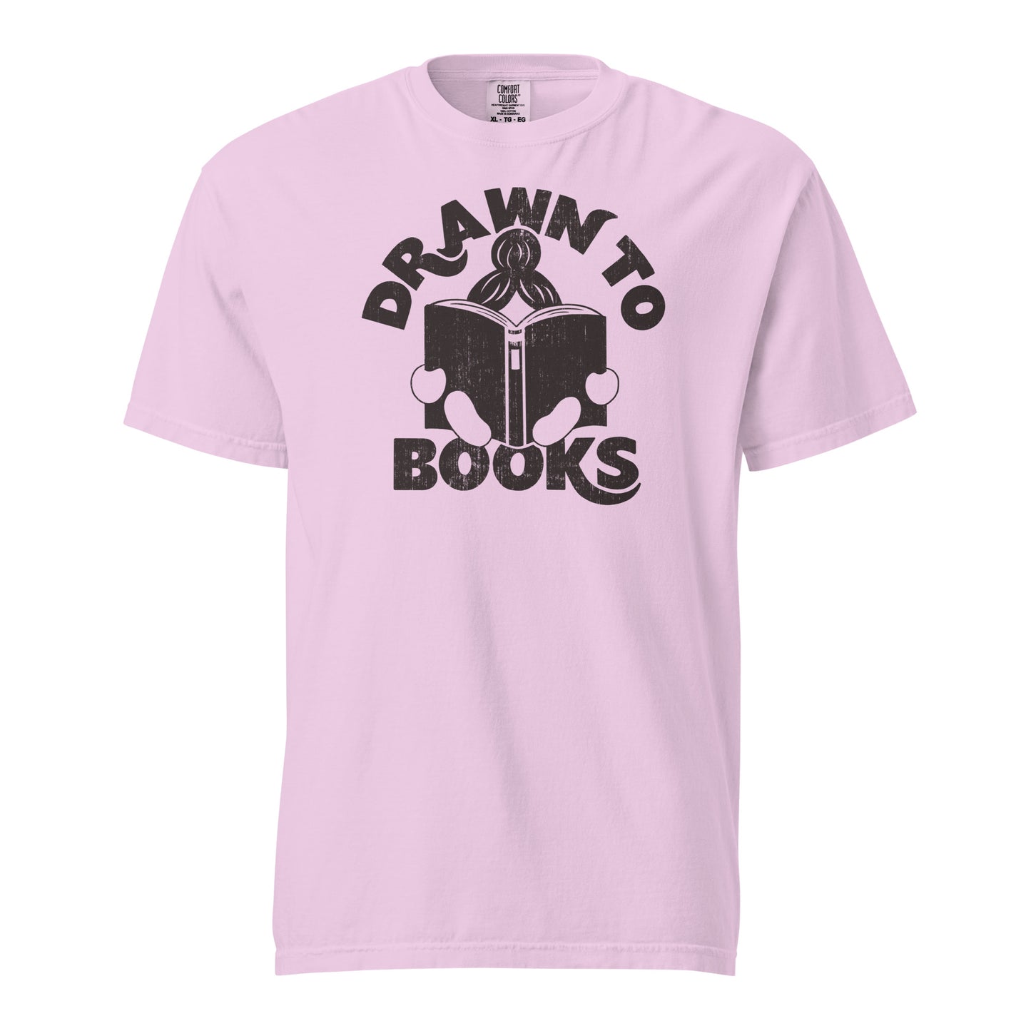 Orchid Purple t-shirt with Drawn to Books logo, text says "Drawn to Books" which is framed around a girl reading a book, and you can see only the top of her ponytail, hands and feet, and the big book she's reading.