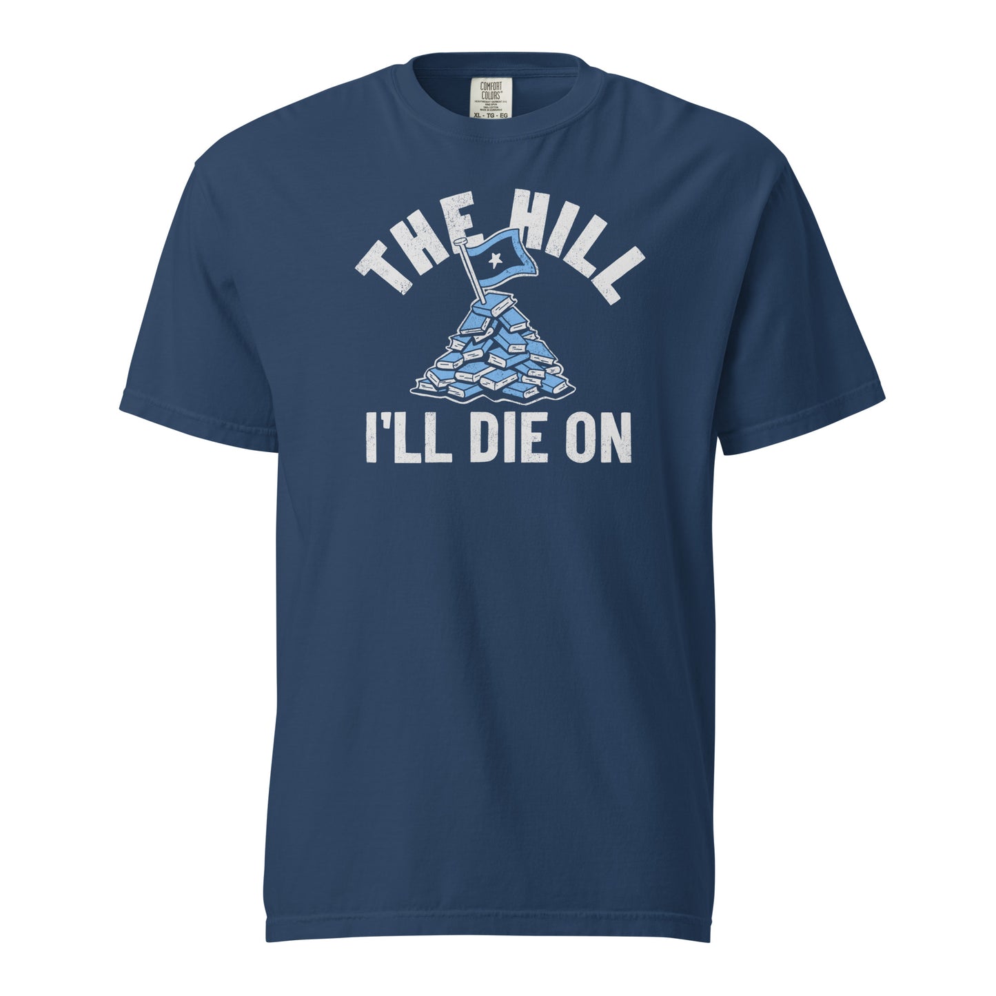 True Navy Blue Comfort Colors T-shirt with a hand-drawn illustration of a light blue stack of books with the phrase "The Hill I'll Die On."