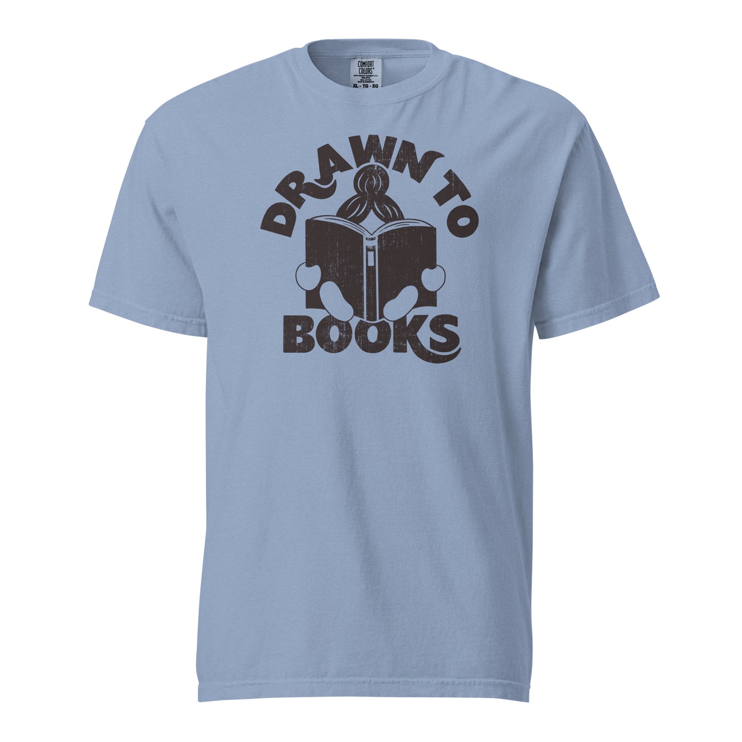 Washed Denim Blue Gray t-shirt with Drawn to Books logo, text says "Drawn to Books" which is framed around a girl reading a book, and you can see only the top of her ponytail, hands and feet, and the big book she's reading.