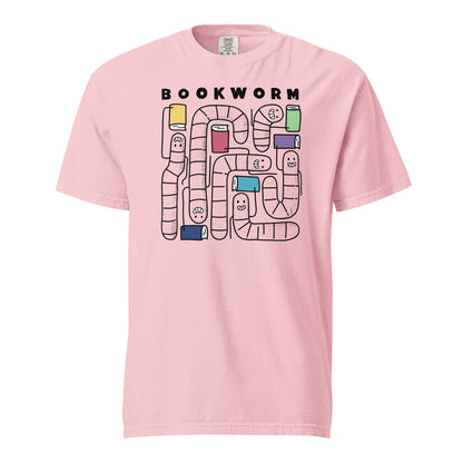 Blossom Pink Comfort Colors t-shirt with 'Bookworm' design, features a hand-drawn design with black outlined worms and happy faces . Each worm is holding up a book.