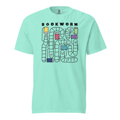 Chalky Mint Green Comfort Colors t-shirt with 'Bookworm' design, features a hand-drawn design with black outlined worms and happy faces . Each worm is holding up a book.