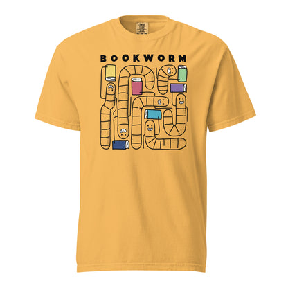 Mustard Yellow Comfort Colors t-shirt with 'Bookworm' design, features a hand-drawn design with black outlined worms and happy faces . Each worm is holding up a book.