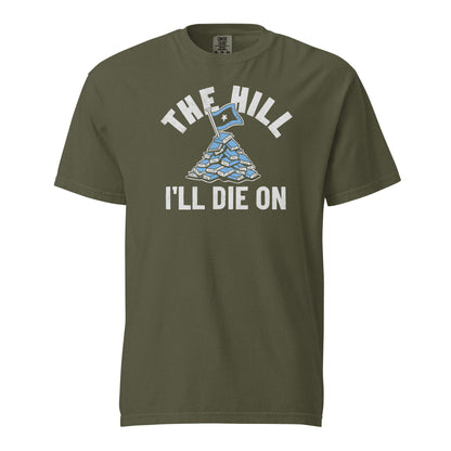 Sage Green Comfort Colors T-shirt with a hand-drawn illustration of a light blue stack of books with the phrase "The Hill I'll Die On." 
